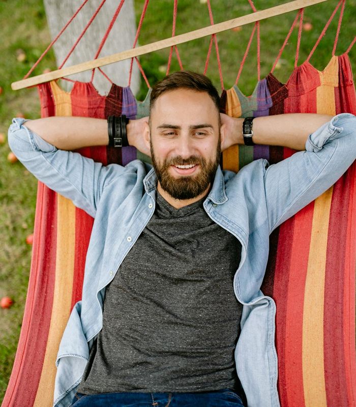Man with hands behind head enjoying fresh air